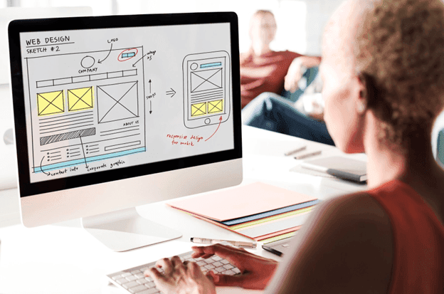 A person planning web design for desktop and mobile